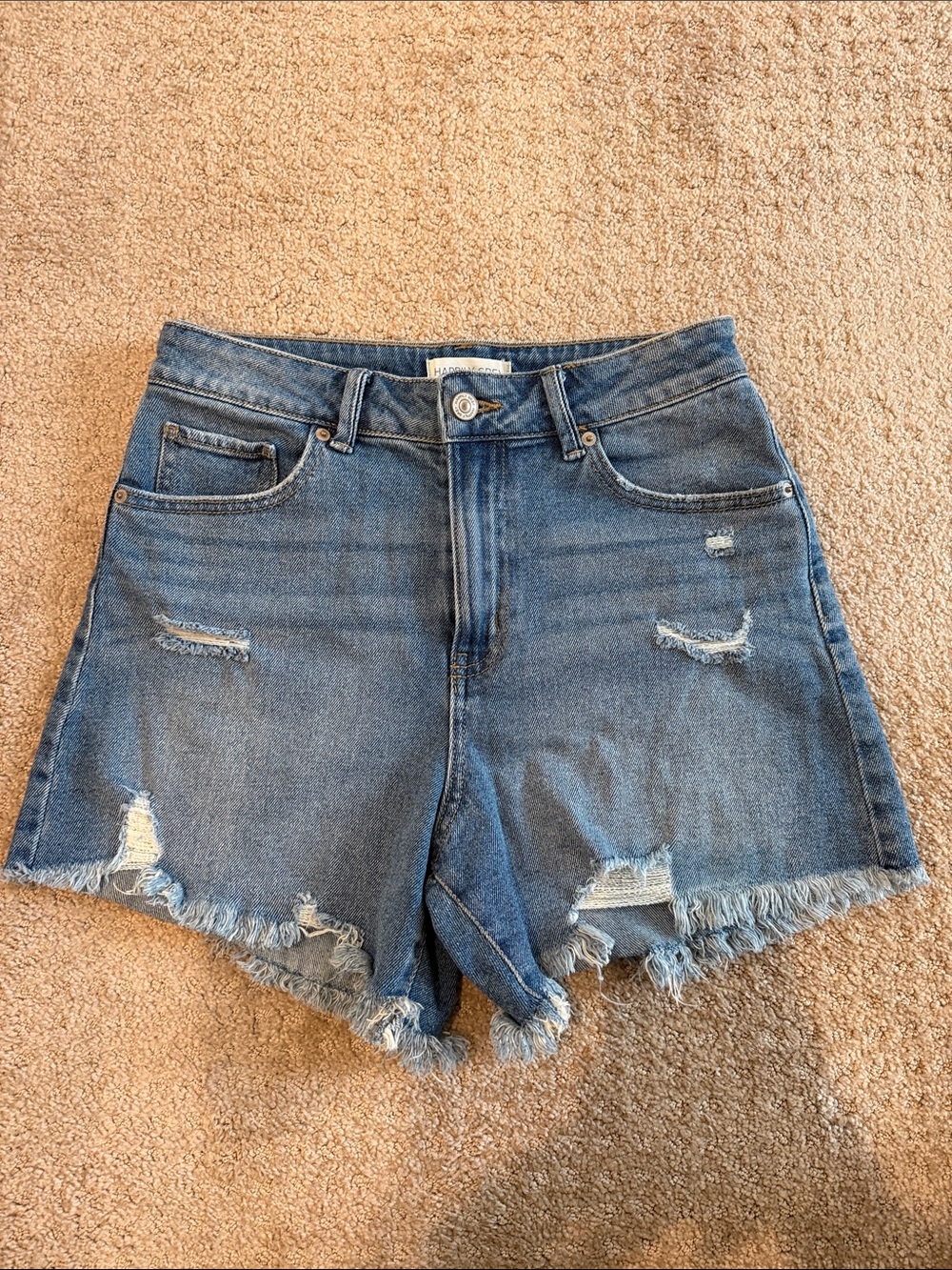 High-Rise Distressed Denim Shorts in Blue
